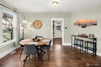 Unit #2015: Another view of the dining room, showing the passage to the kitchen and door to the covered back porch beyond.