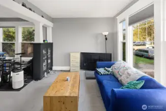 Unit #2011: First view of unit #2011, tenant-occupied. The living room features the beautiful original built-in cabinets and pillars.