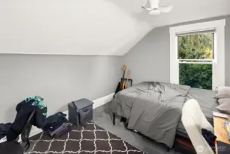 Unit #2011: The third, rear bedroom is adjacent to the bathroom, and also looks out over the lush green yard.