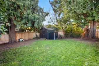The house is set at the far end of the 5,400 SF lot, preserving a huge yard space for play or even further development (buyer to verify). Garden shed was built on-site, and makes great tool and toy storage.