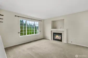 Living room with natural gas fireplace.