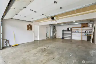 2 car garage with built in shelving. Newer furnace and air conditioner and gas water heater.