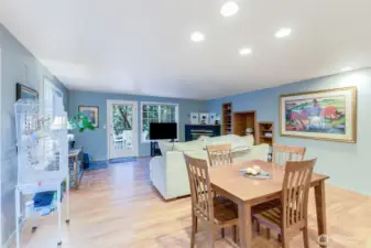 Living and dining showing the Gas fireplace and view to back deck