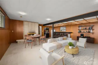 Family room with bar and fireplace (virtually staged)