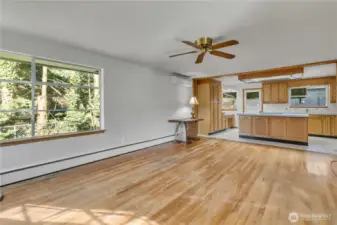Bright, open living space with large windows and hardwood floors. The kitchen was updated in the 1980's, great for entertaining!