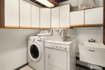 Good sized laundry with sink in basement.