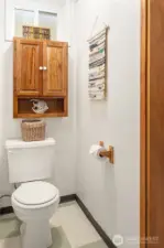 Private half bath with laundry sink just outside of door.