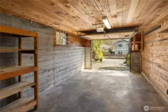 Oversized one car garage with electric door opener.