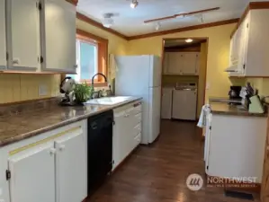 Spacious kitchen with numerous cabinets.