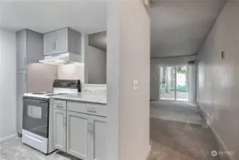 View from entry way, kitchen on the left and livingroom straight ahead.