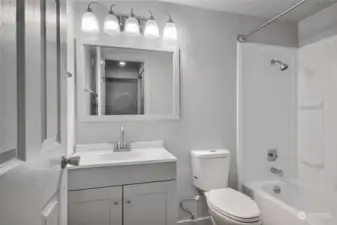 Updated bathroom with attractive modern bathroom and lighting fixures.