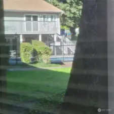 Condominium unit is near pool.  View of pool from livingroom and bedroom.