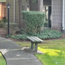 Bench on walkway by your unit.