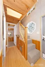Stairs to sleeping loft. Hallway to bedroom and bath