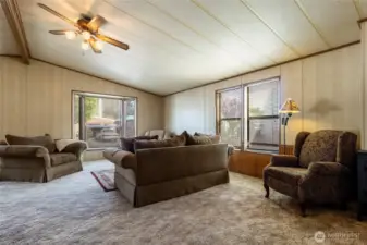 Open floor plan, ample windows letting in natural light.