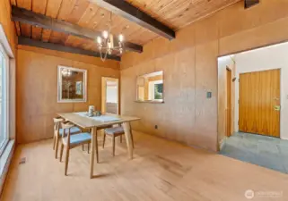 Another view of the dining room with the front entry in the background.