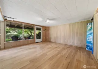 Lower level primary suite with large windows, two closets and an impressive brand new bathroom.