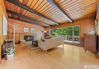 Vaulted ceiling and big windows in the living room.