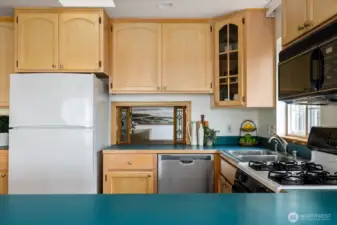 Leaded glass windows open into the formal dining room.