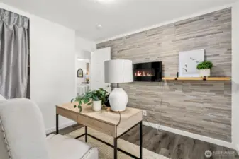 Bedroom number three with Electric fireplace on wall, completely remodeled