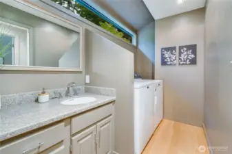 Hall bath with laundry.