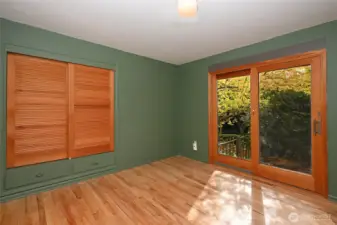 Second bedroom with sliding door to the back.
