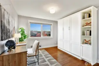Beautiful custom made Murphy bed in 2nd bedroom.