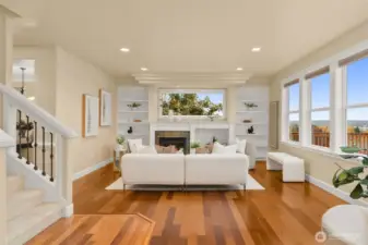 Notice the tiered ceilings and custom built-in shelves