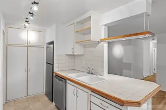 Bright, timeless white kitchen beautifully accented with warm wood tones for a classic, inviting look