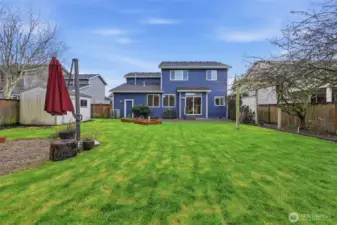 Beautiful and well maintained backyard offers space for all your needs!