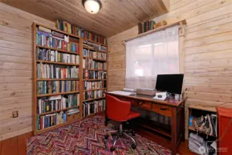 qquaint country bedroom or office with hidden cubbies and built ins.