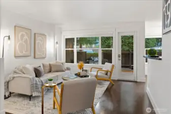 Living room open to kitchen and dining space.