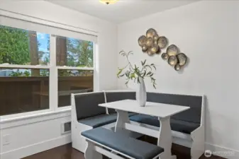 Cheery dining space with views to patio and beyond.