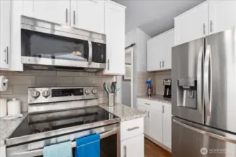 Open concept kitchen with stainless steel appliances