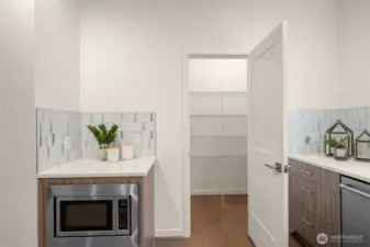 Kitchen with walk-in pantry (staged)
