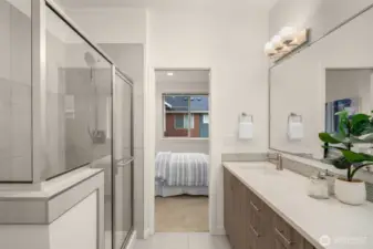 Ensuite bathroom w/ walk-in closet (staged)