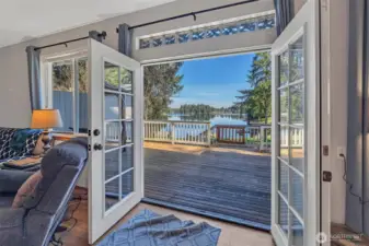 Main floor French doors opening to deck with lake view