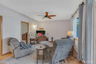 Main floor living room with large windows