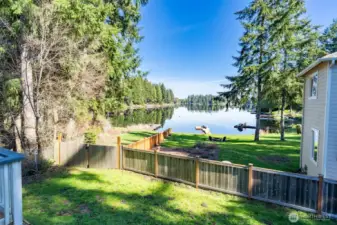 Backyard with access to private dock and lake
