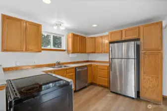 The kitchen has stainless appliances and the fridge and range are about 1.5 years old and the dishwasher is new.