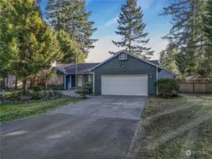 Gate To Side Yard And RV Parking Is To The Right Of The Garage.