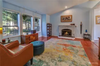 Front Living Room With Vaulted Ceiling And Gas Fireplace.