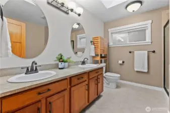 Spacious primary ensuite with separate tub and shower