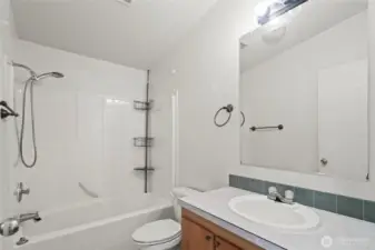 Here's the second full bathroom with tub and shower insert, an oversized vanity and a large mirror. Perfect for overnight guests!