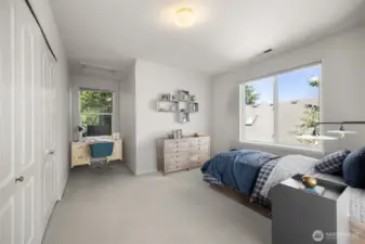 Another bedroom has two dormer alcoves.