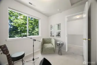 Another bedroom with staging as a music room.