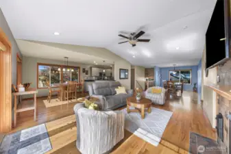 Full-circle perspective emphasizes the effortless flow from dining to deck, kitchen to living—ideal for entertaining or relaxing while soaking in filtered views of Birch Bay through every window.