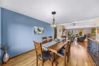 From this angle, the dining space seamlessly integrates with the rest of the home’s open concept layout, maintaining warmth and connectivity—perfect for hosting guests or family-style dinners