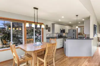 From the dining nook, enjoy beautiful backyard views and the convenience of a central location between kitchen and living room—perfect for morning coffee or hosting friends