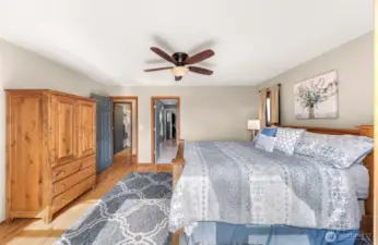 Natural light pours into the primary bedroom, which connects seamlessly to the en suite bath and walk-in closet. Soothing wall tones and quality finishes add to the retreat-like feel.